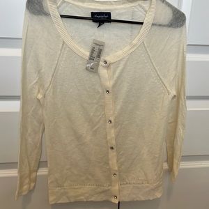American eagle cardigan new with tags. Medium Jewel buttons. Cream color.